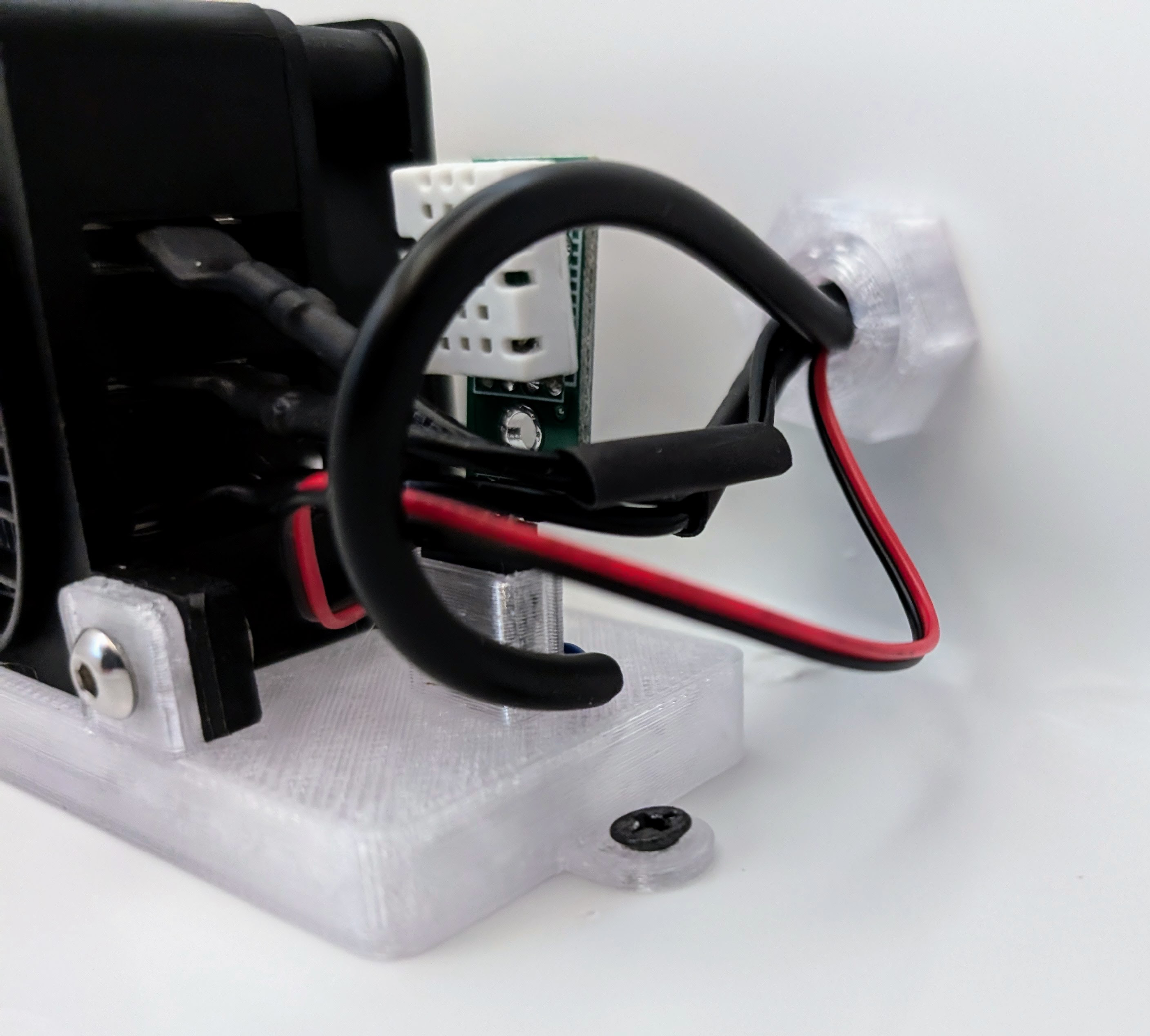 Run wires through the cooler wall, then secure the cooler plug with the 3D-printed nut.