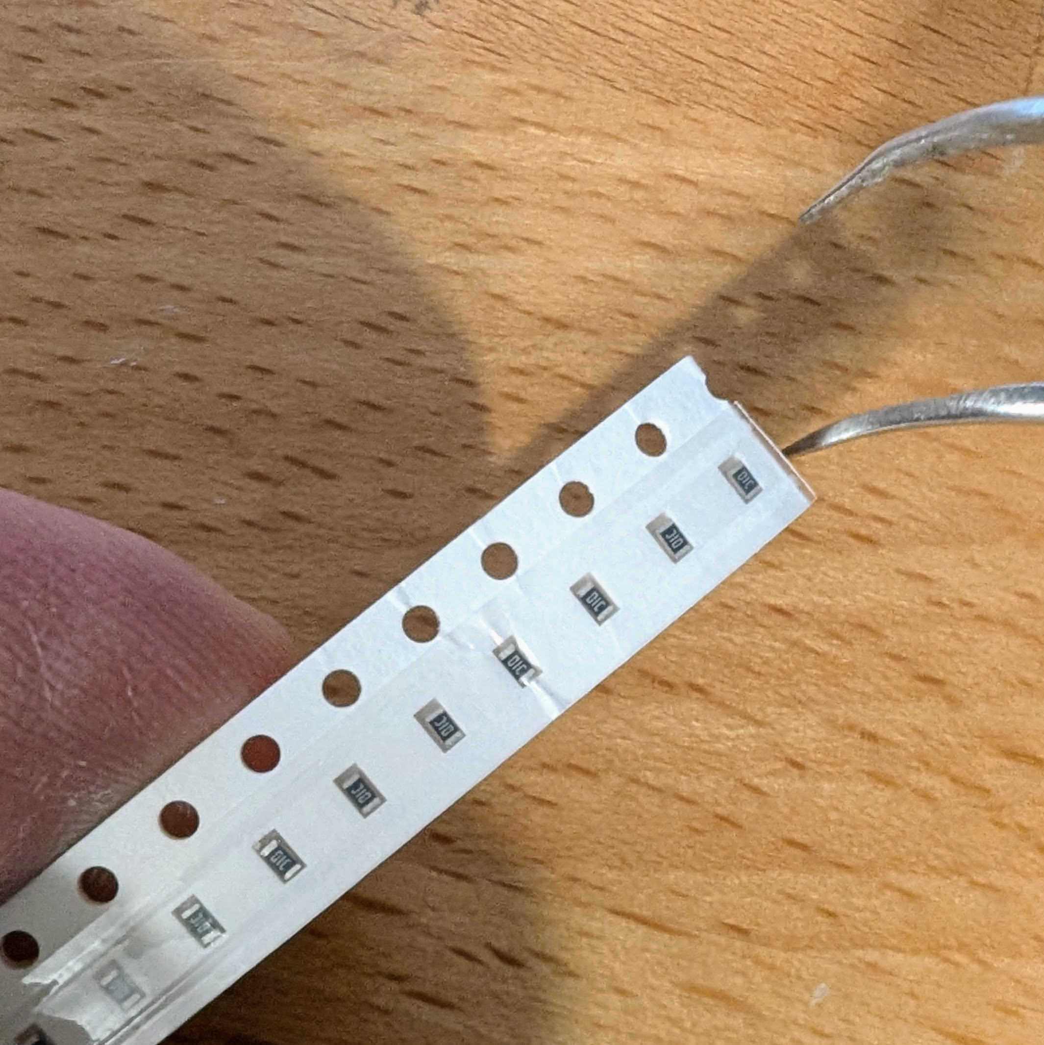 Handling SMT tape to extract components