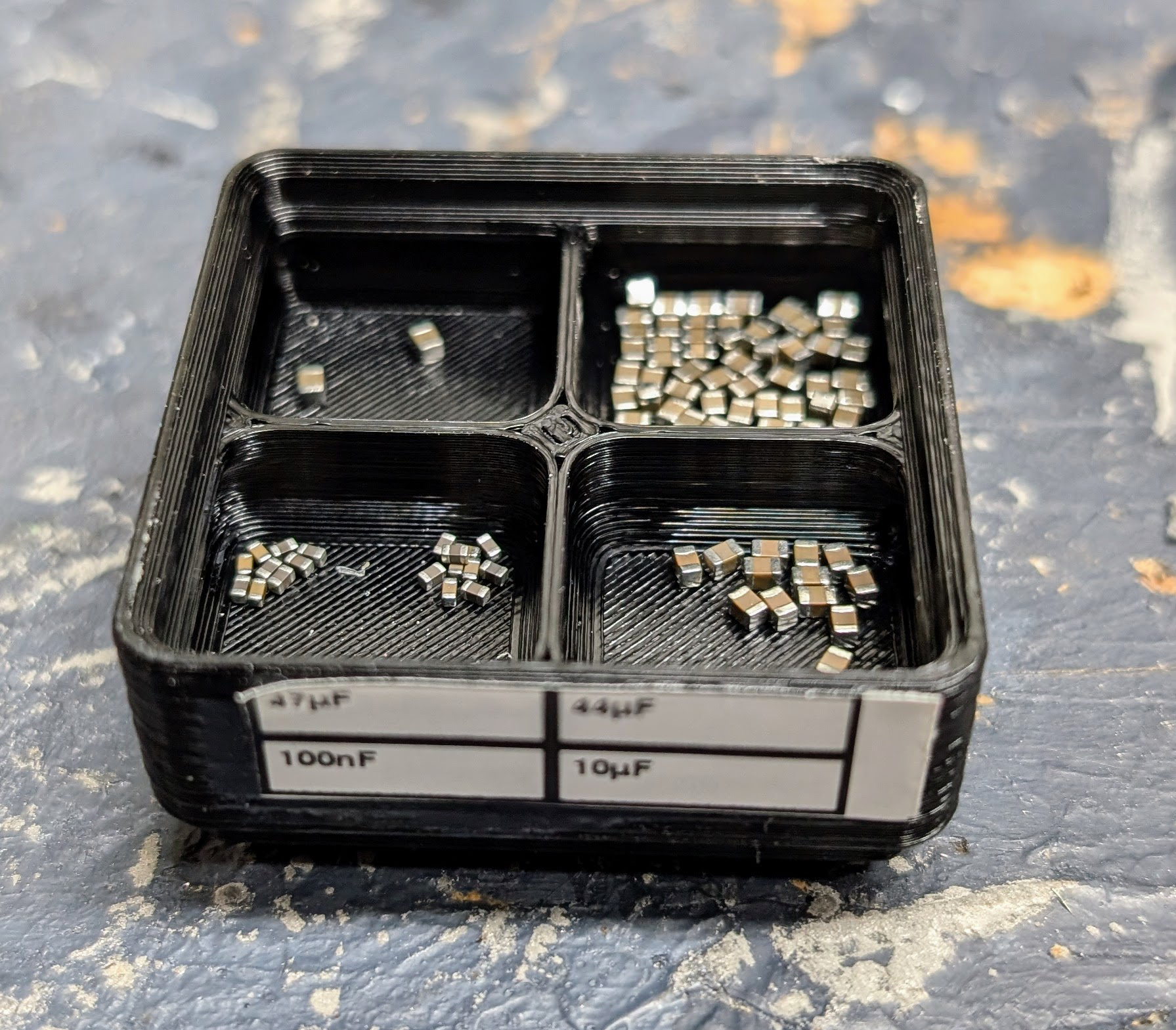 SMD 2x2 pick bin tray with 0603 capacitors
